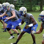 trojans71 Bruce Trojans Darrian Sullivan, Latrell Marks and Russ Owen work on special teams at Monday's practice.
