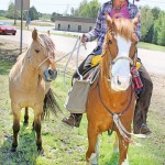 sea rhydr3 Sea G. Rhydr with her two horses this past April as they made their way through Pittsboro. Photo by Joel McNeece